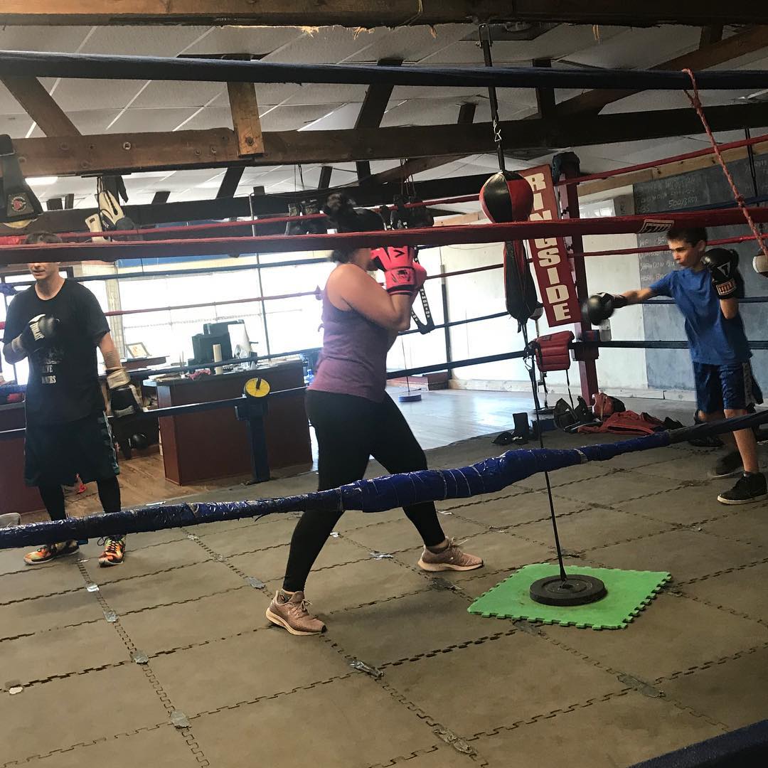 Family boxing workout inside Port City Boxing